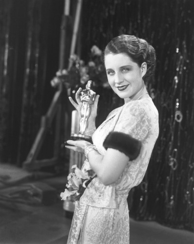 Norma Shearer with her statuette for "The Divorcee."